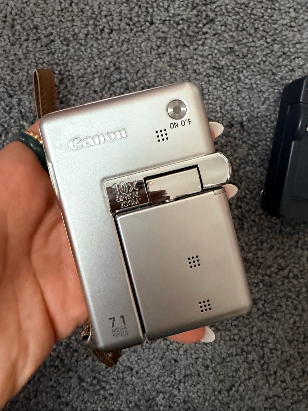 Canon Silver Compact Camera with 10x Optical Zoom with free chanel pouch.